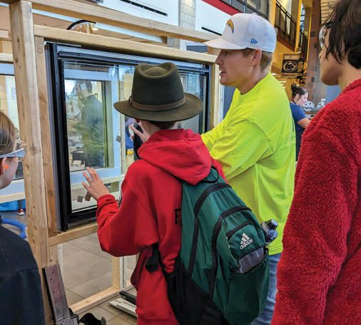 glazing installation demonstration for students at trades night